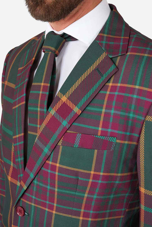Man met een tartan plaid kerstpak, close -up jas