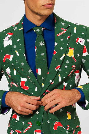 Man draagt ​​een groen kerstpak en blauw overhemd, close -up