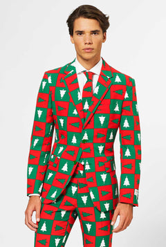 Man draagt ​​rood en groen kerstpak
