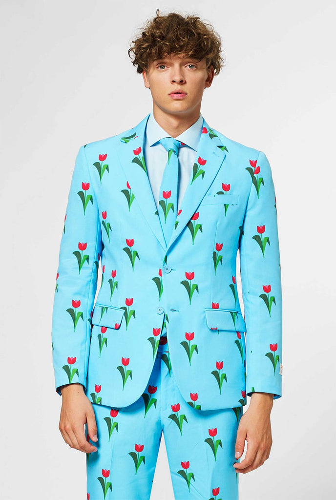 Man draagt ​​lichtblauw herenpak met tulpen print