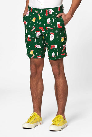 Man draagt ​​een groen kerst in kersts zomer, bestaande uit shorts, jas en stropdas, close -up van broek