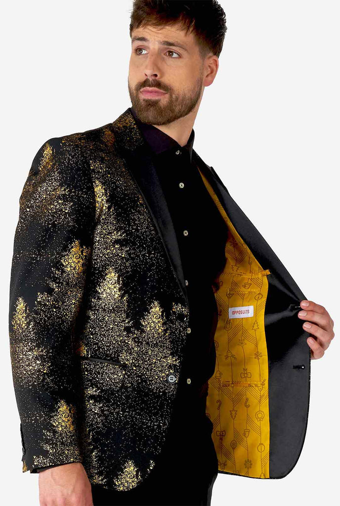 Man draagt ​​zwarte blazer met gouden kerstboomafdruk
