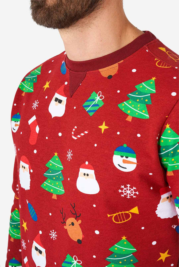 Man draagt ​​een rode kersttrui met kerstpictogrammen, close -up