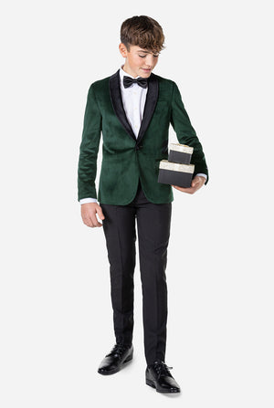 Tiener met groen fluwelen kerstdiner jas
