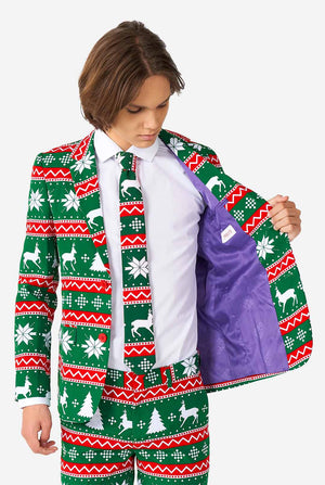 Tiener draagt ​​groen formeel kerstpak