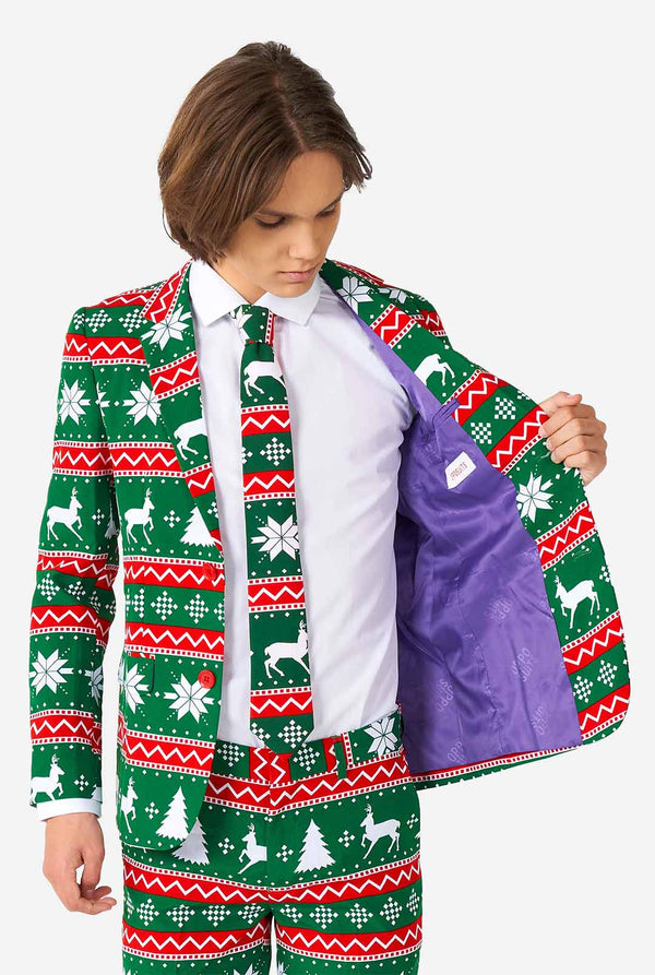 Tiener draagt ​​groen formeel kerstpak
