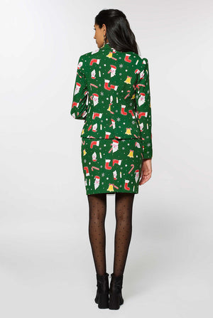 Vrouw met een groen pak met kerstpictogrammen, bekijk vanaf de achterkant