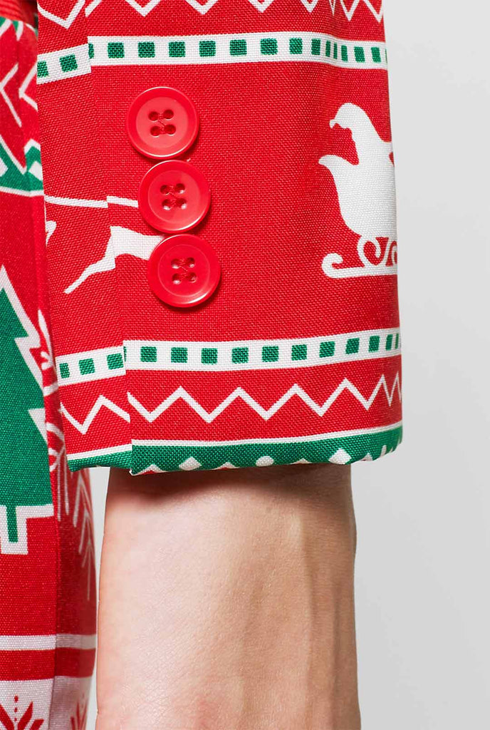Vrouw draagt ​​een rood kerstpak met kerstpictogrammen, mouw close -up
