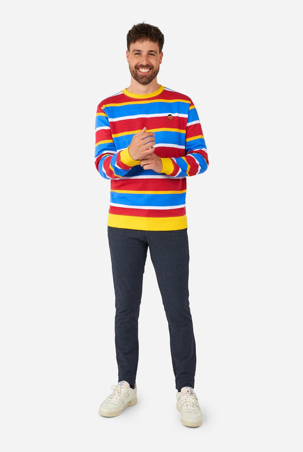 Man met herentrui met iconisch Sesamstraat Ernie-patroon met gele, rode, blauwe en witte strepen