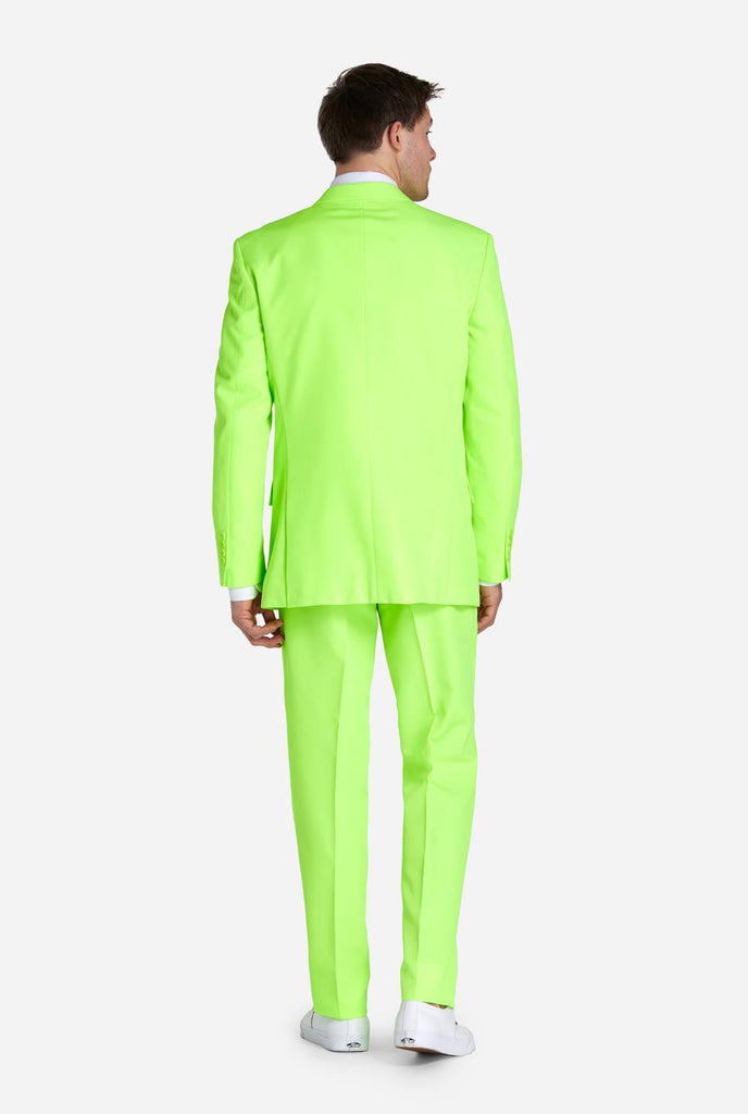 Man wearing neon lime green colored suit, view from the back